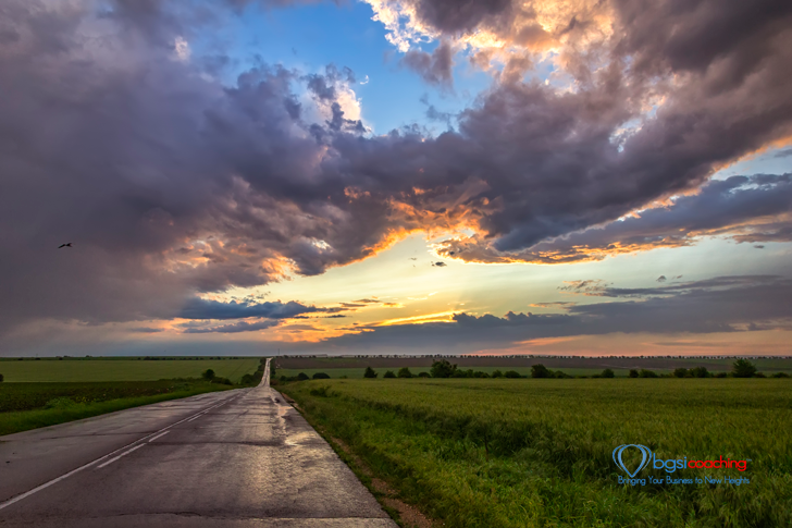 BGSICoaching | The Way | Road and field under a clearing sky
