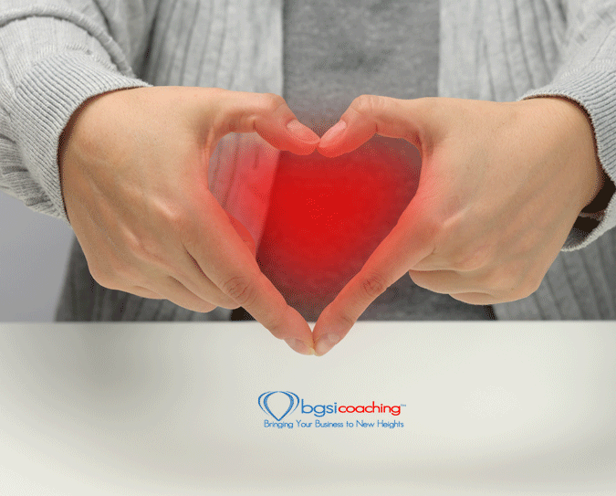 kindness and positivity | woman making heart with her hands | BGSICoaching | MOJO The Meaning of Life and Business Podcast