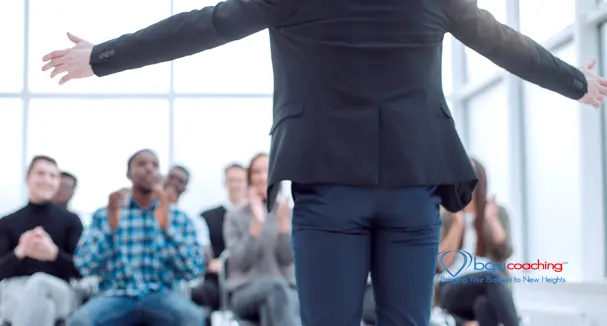 BGSICoaching | Person standing in front of room | Speak from the heart